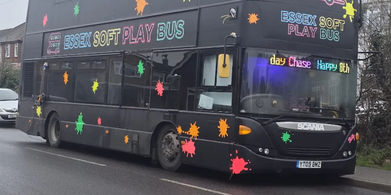 Essex Soft Play Bus = black double decker with colourful splashes
