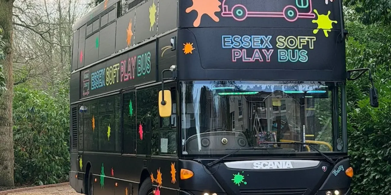 The Essex Soft Play Bus double decker soft play party bus parked at a children's party venue in Essex