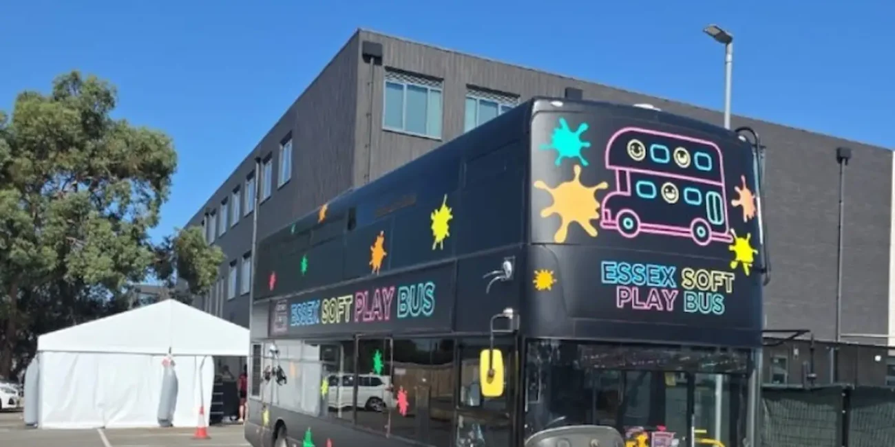 The Essex Soft Play Bus double decker children's soft play party bus arriving at an event venue in Essex