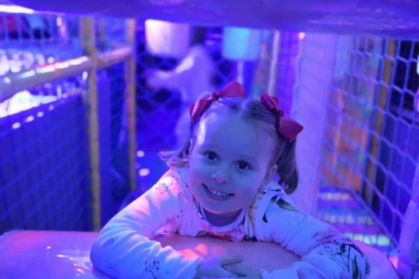 Child Crawling Through the Soft Play Tunnel Inside the Essex Soft Play Bus Child crawling through the neon soft play tunnel inside the Essex Soft Play Bus.